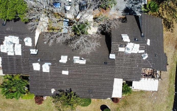 Aerial view of a residential roof replacement in progress by Meyer's Pride Roofing, a trusted local roofer in Dallas.