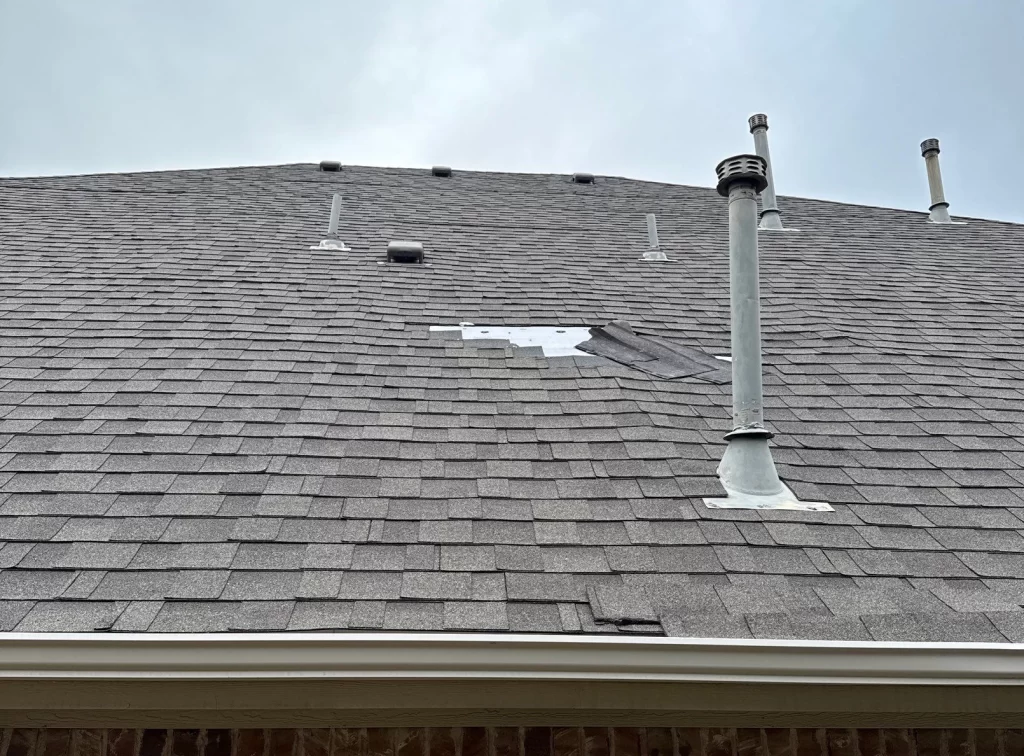 Damaged shingles on a residential home in Richardson